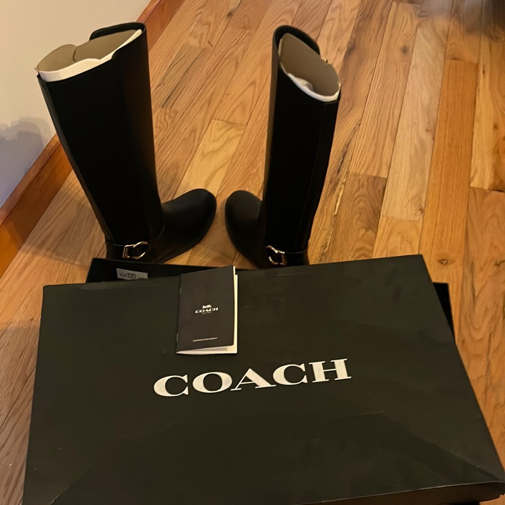 Brand new still in box with certification info. Black knee high COACH boots